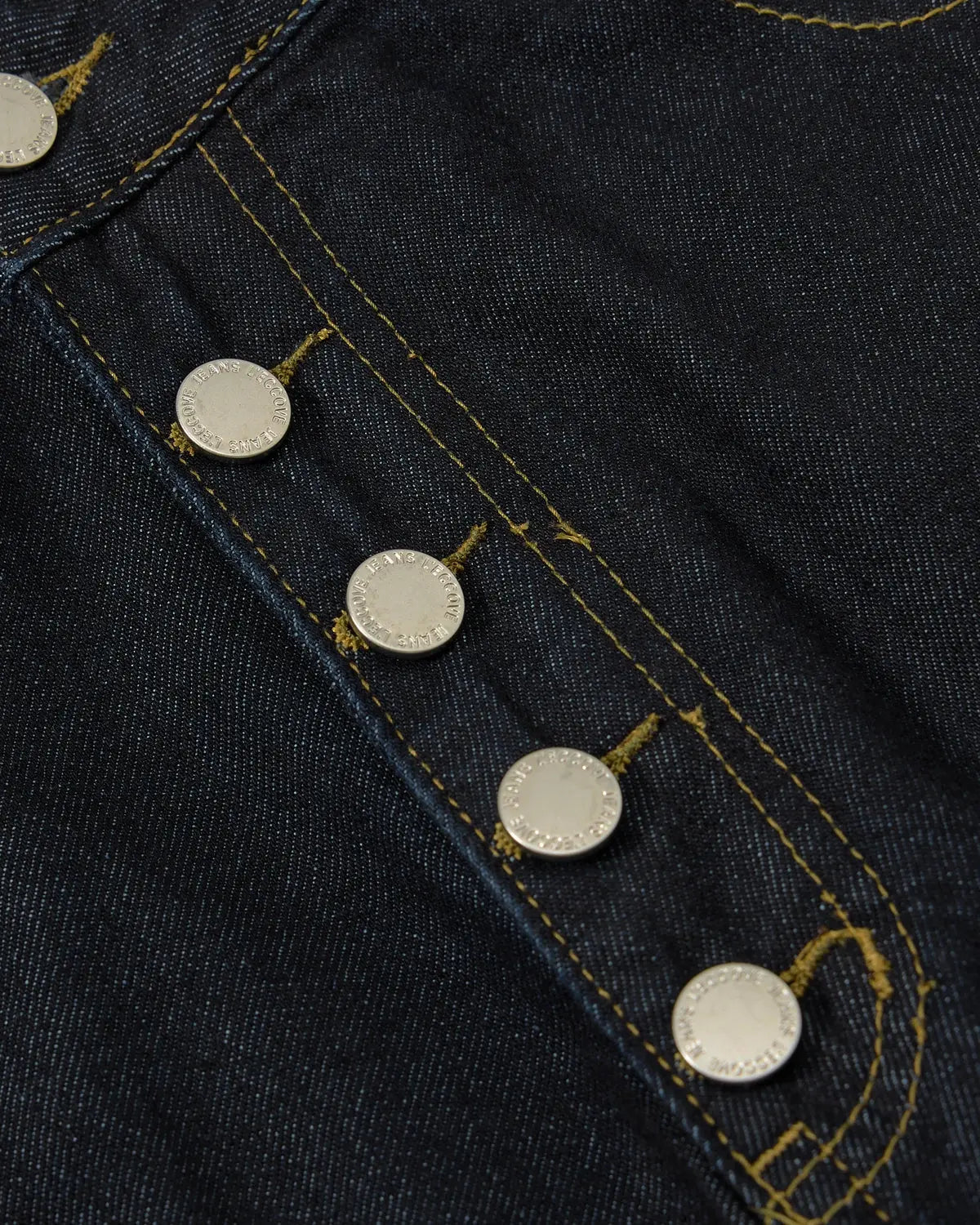 INFLATION Cinch Back Buttons Up Cargo Jorts featuring a relaxed fit, cargo pockets, and stylish button details on denim shorts.