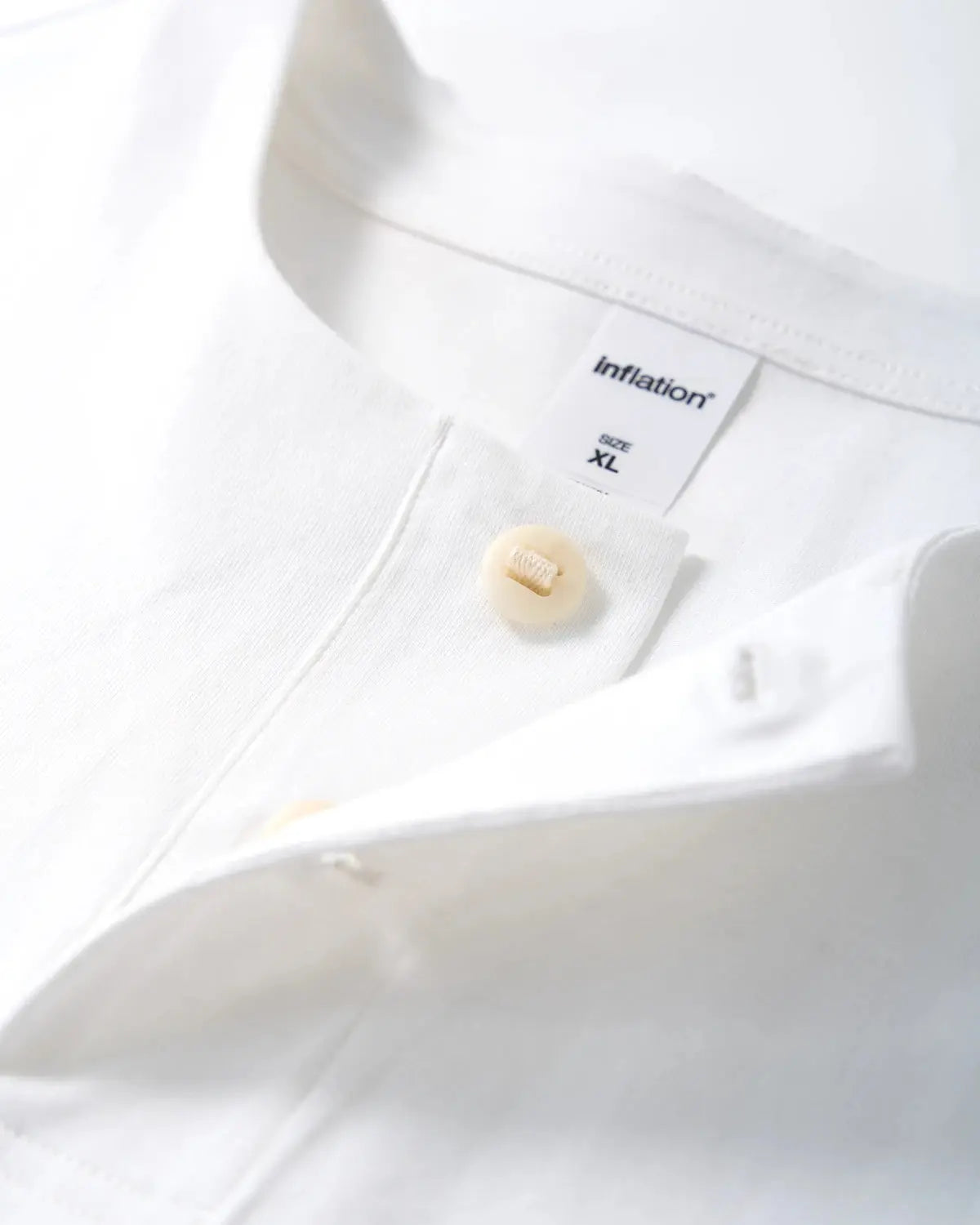 Old Money Henley Collar T-Shirt by INFLATION, men's casual T-shirt with henley neckline and vintage-inspired style, shown in navy color.