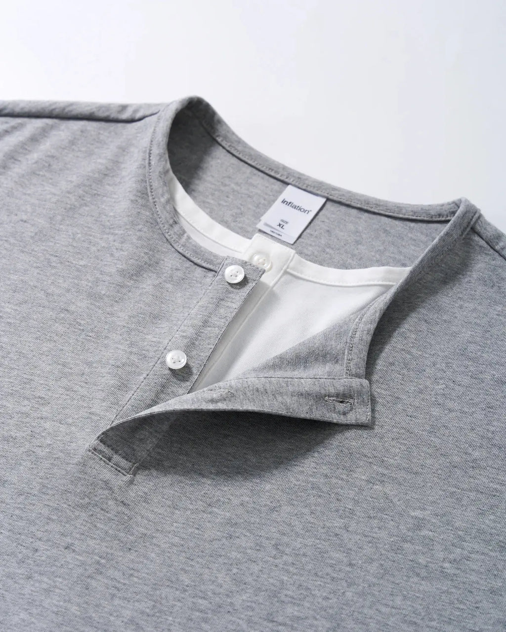 Old Money Layered Henley T-Shirt by INFLATION, men's casual shirt with layered design, in neutral tones, shown on a mannequin.