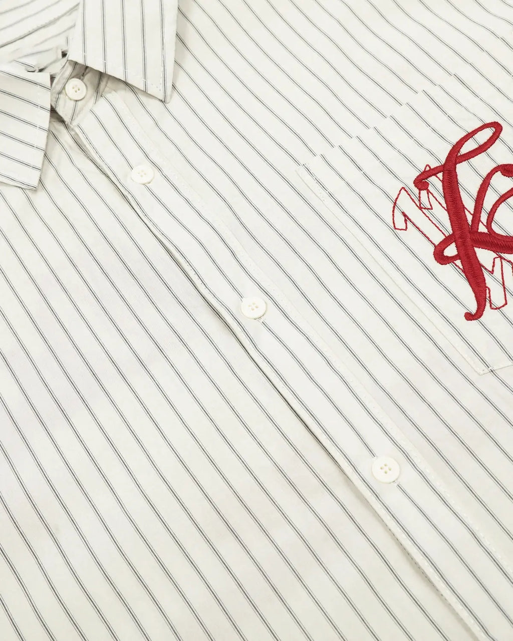Inflation Streetwear striped embroidered short-sleeve shirt with colorful pattern and casual fit, displayed on a mannequin.