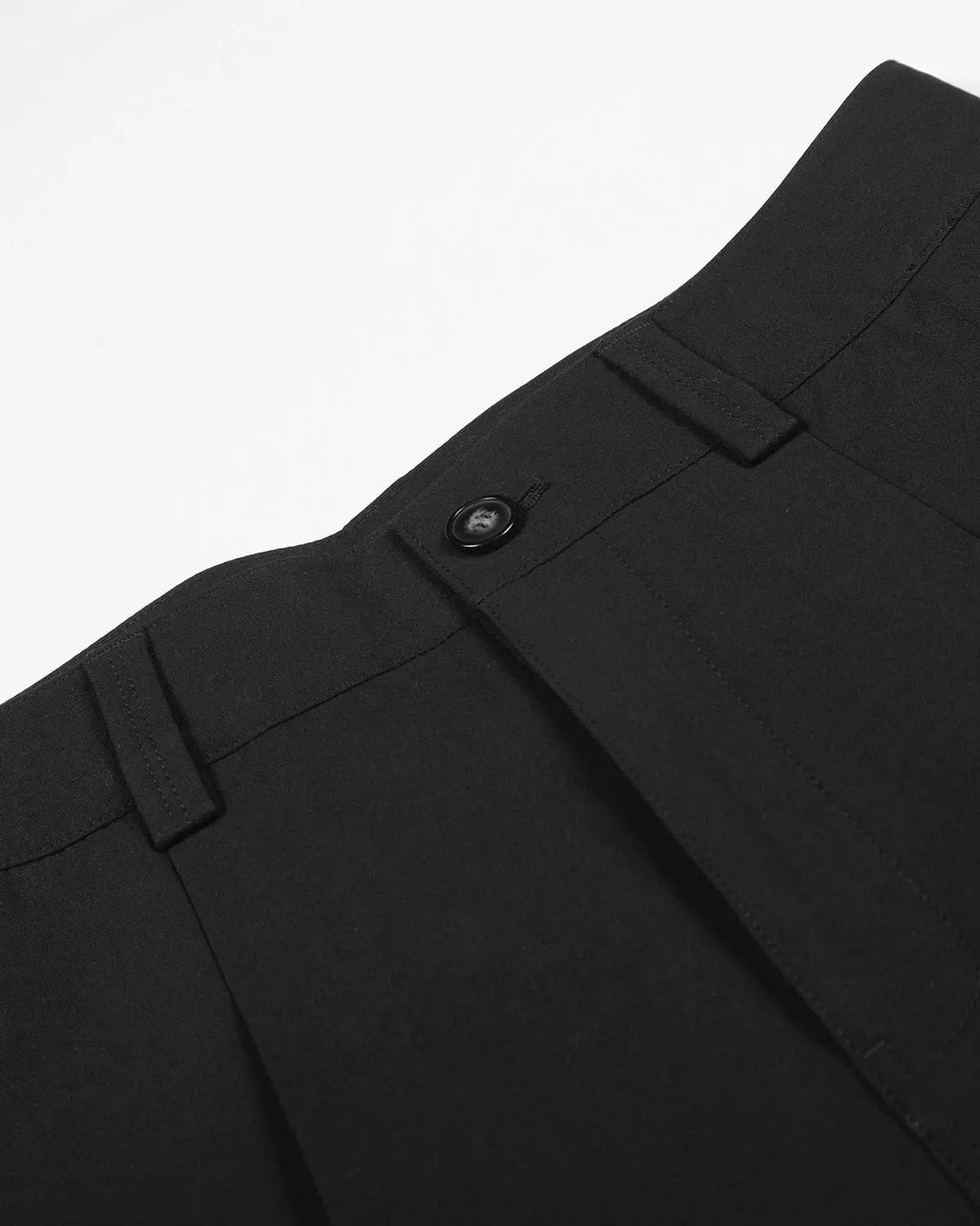 Inflation Streetwear pleated cinch back tailored shorts, stylish pants with a high waist and structured fit, shown in black.