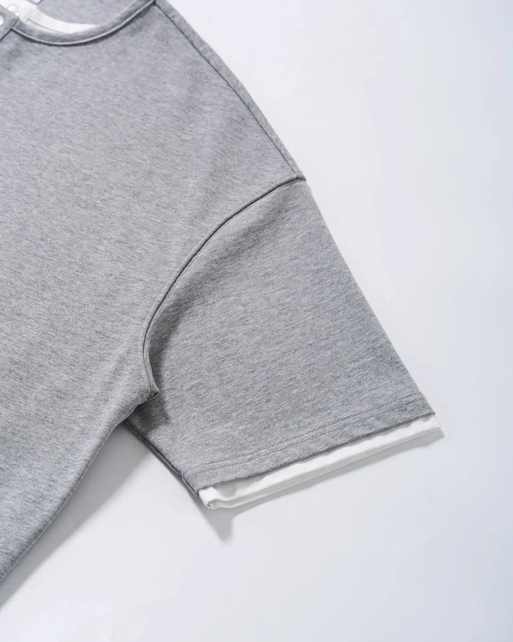 Old Money Layered Henley T-Shirt by INFLATION, casual shirt with layered design, featuring a round neckline and soft fabric.