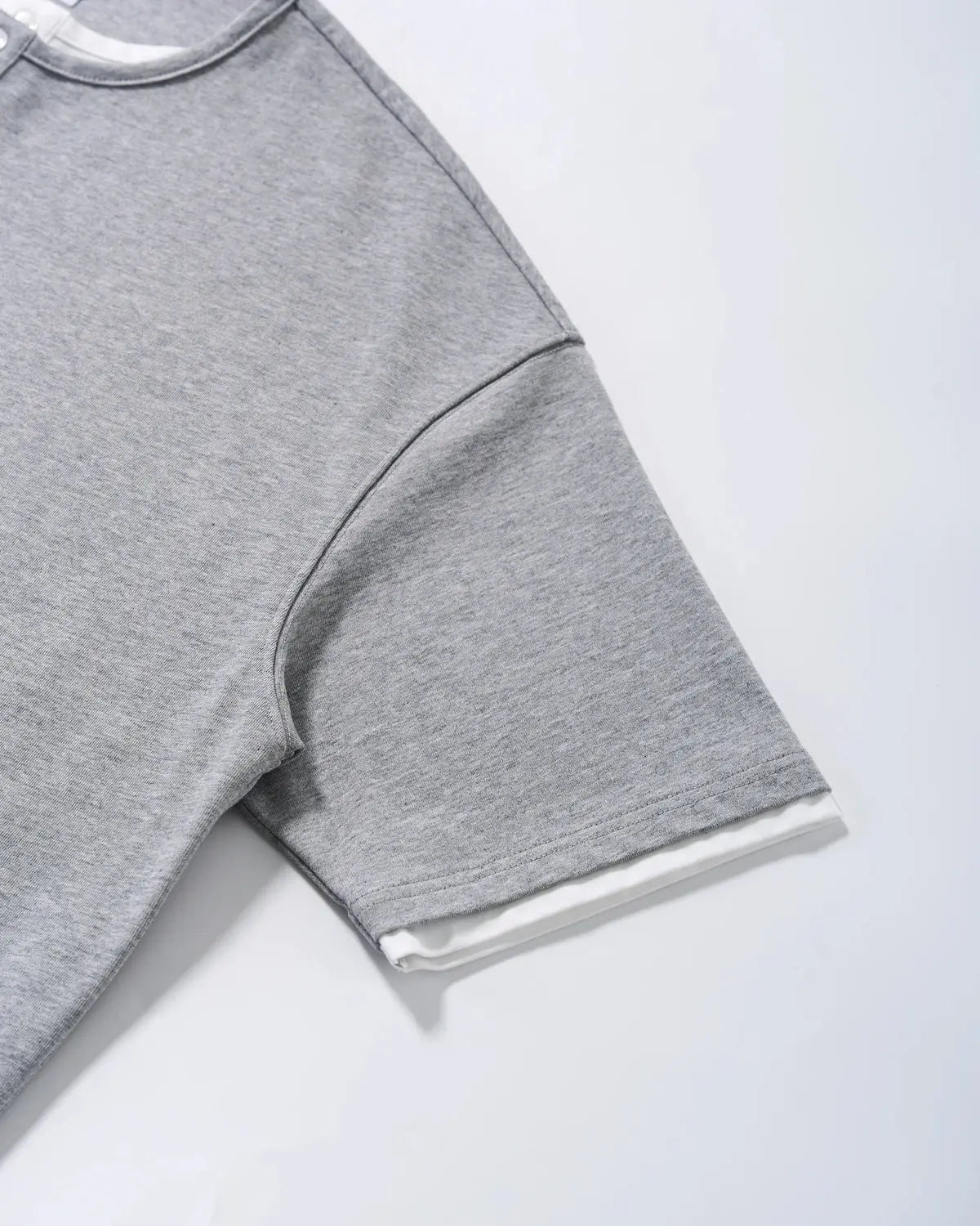 Old Money Layered Henley T-Shirt by INFLATION, casual shirt with layered design, featuring a round neckline and soft fabric.