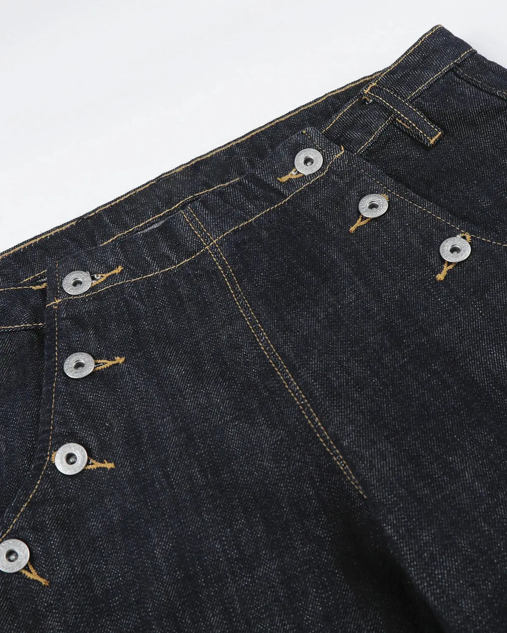 Raw wide-leg jeans with button details from Inflation Streetwear, featuring a relaxed fit and classic denim texture.