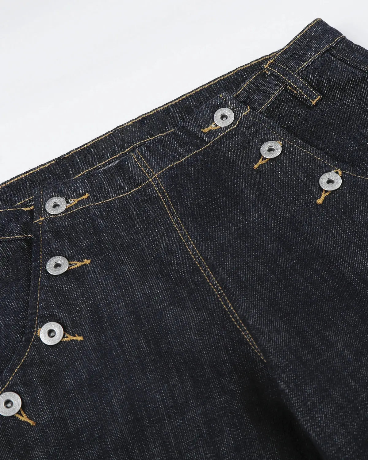 Raw wide-leg jeans with button details from Inflation Streetwear, featuring a relaxed fit and classic denim texture.