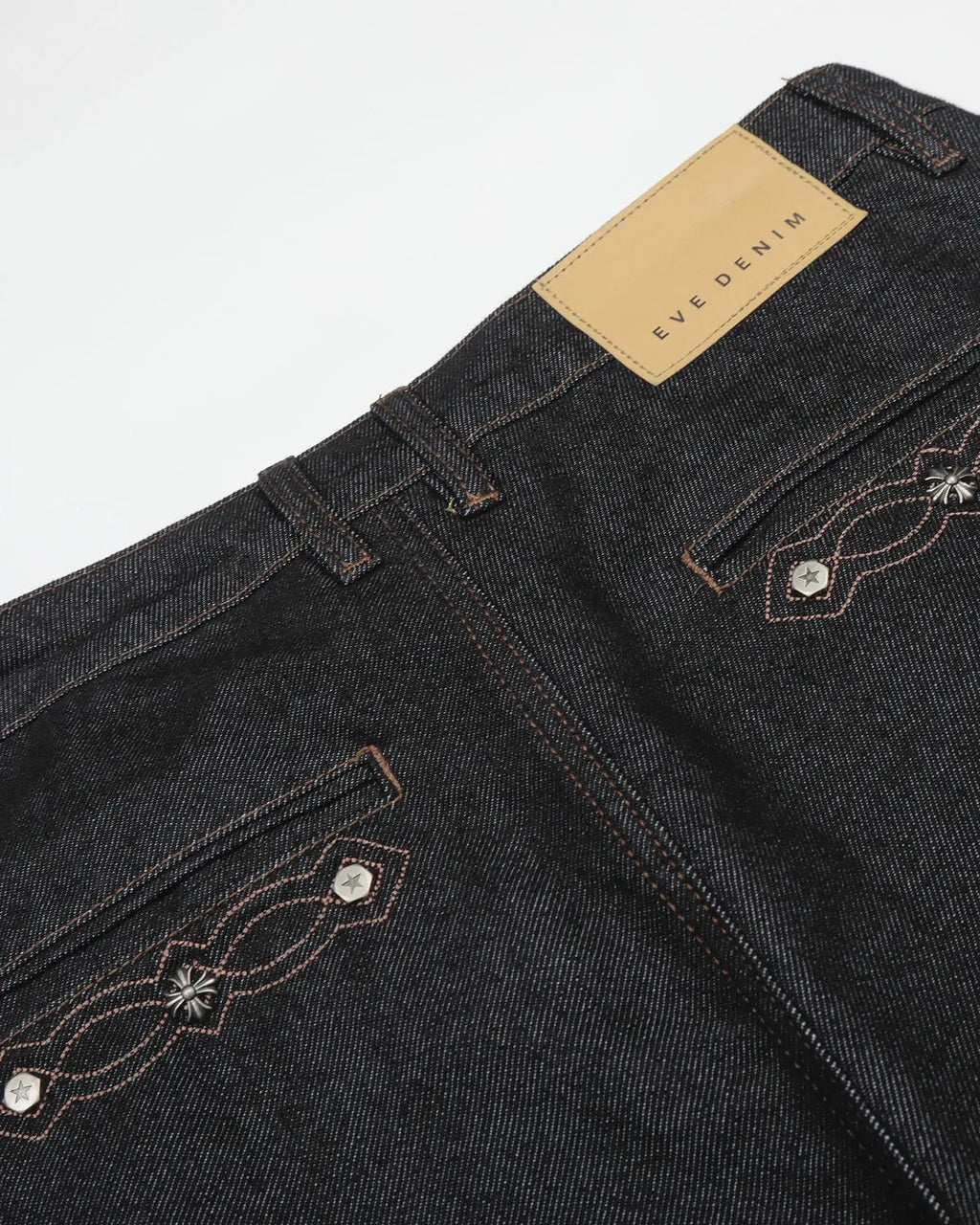 Vintage embroidered bootcut jeans by INFLATION with detailed floral embroidery on denim, showcasing a classic retro style.