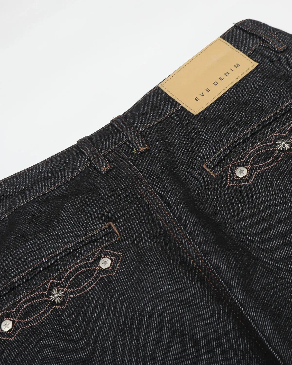Vintage embroidered bootcut jeans by INFLATION with detailed floral embroidery on denim, showcasing a classic retro style.