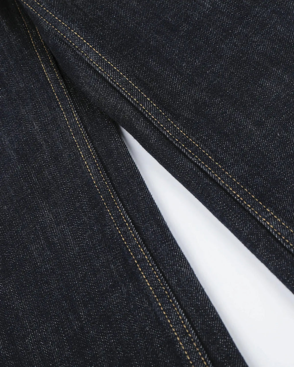 Inflation Streetwear button detail raw wide-leg jeans showing distressed denim and wide-leg cut on a neutral background.
