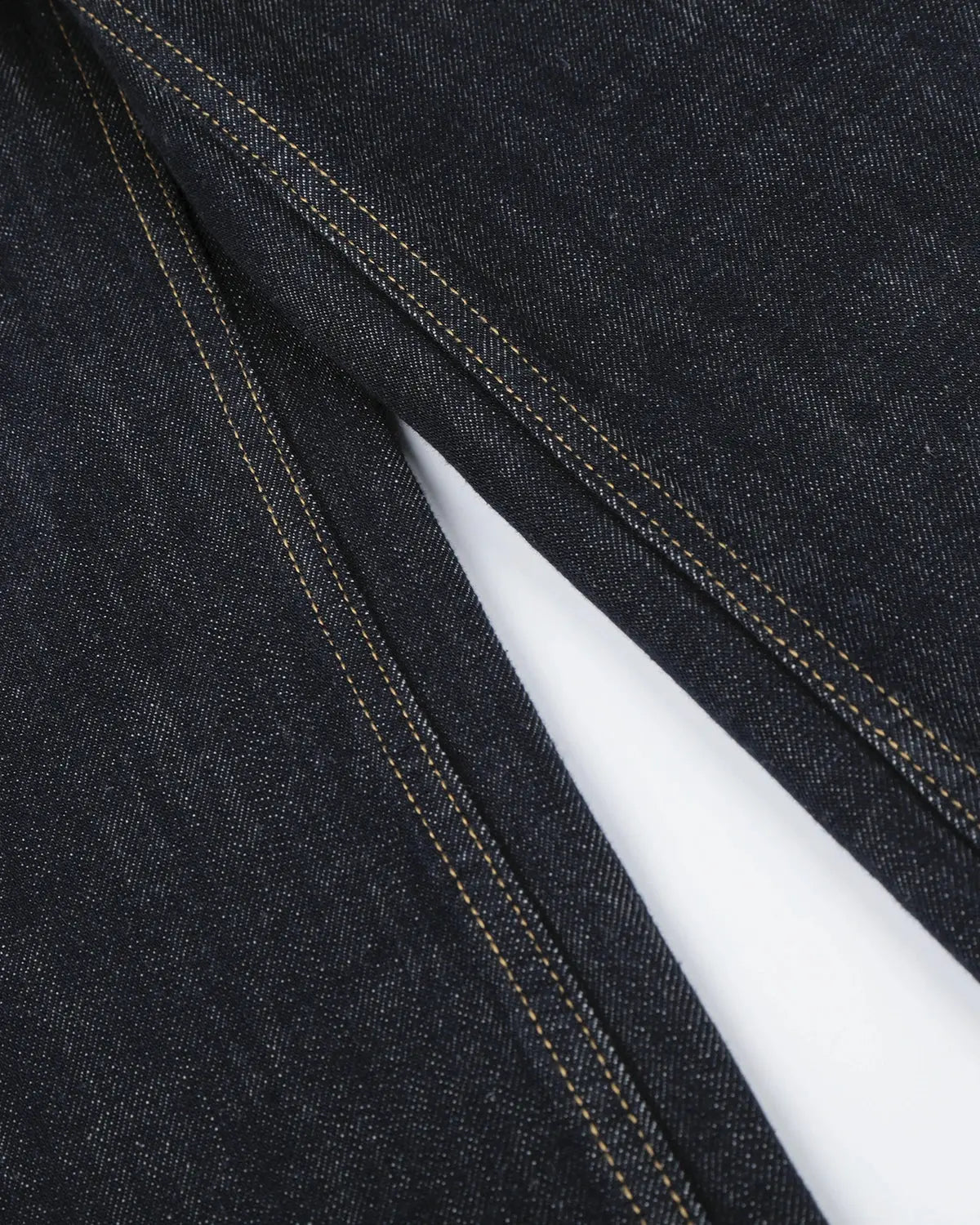 Inflation Streetwear button detail raw wide-leg jeans showing distressed denim and wide-leg cut on a neutral background.