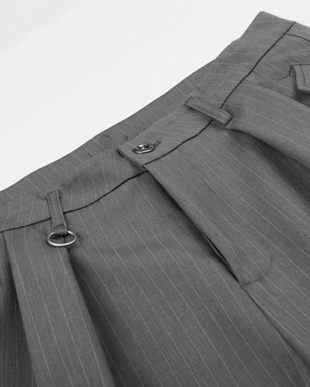 INFLATION pinstripe pleated tailored shorts with ring detail, featuring a stylish design and structured fit for streetwear fashion.