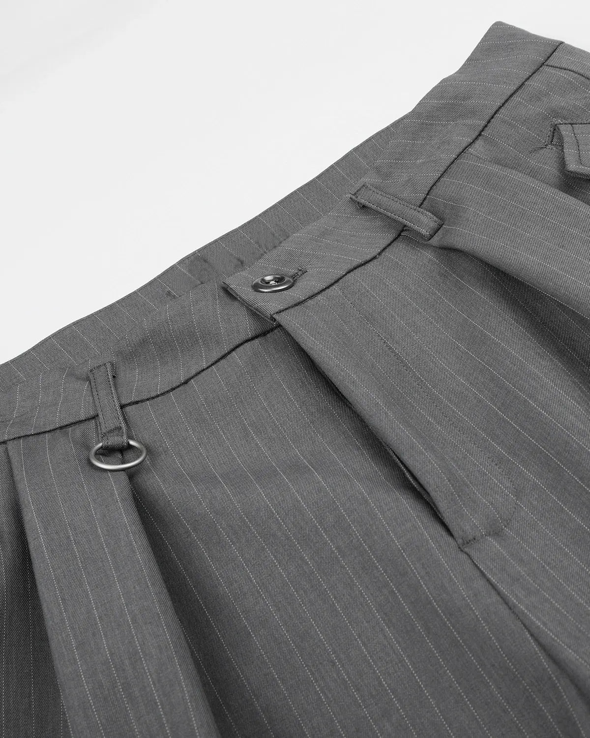 INFLATION pinstripe pleated tailored shorts with ring detail, featuring a stylish design and structured fit for streetwear fashion.