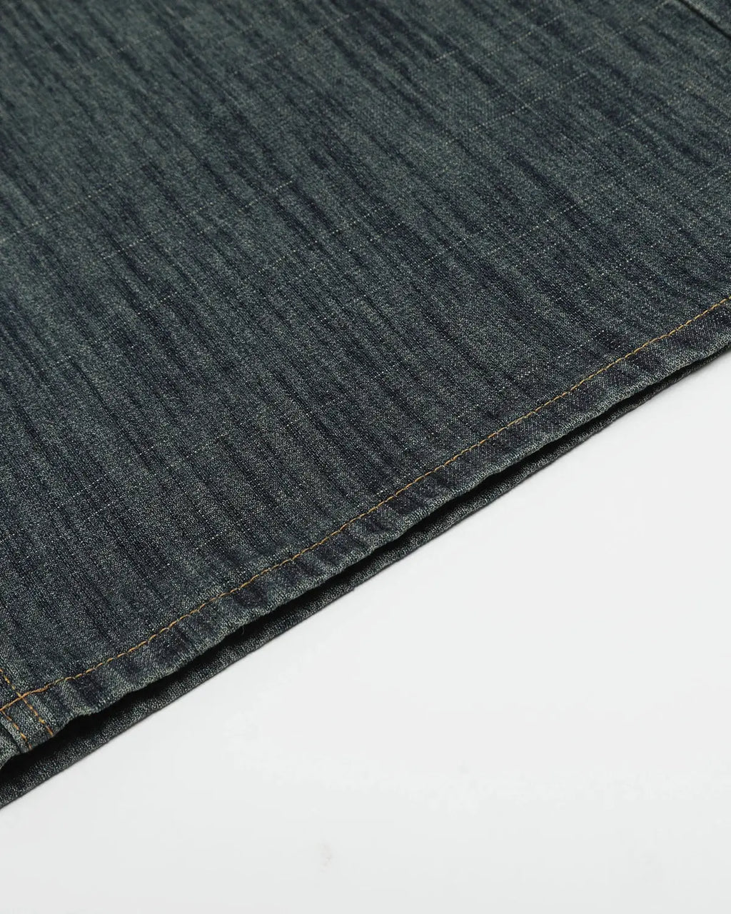 Raw wide-leg long jorts by INFLATION streetwear, featuring distressed denim and relaxed fit, displayed on a hanger.