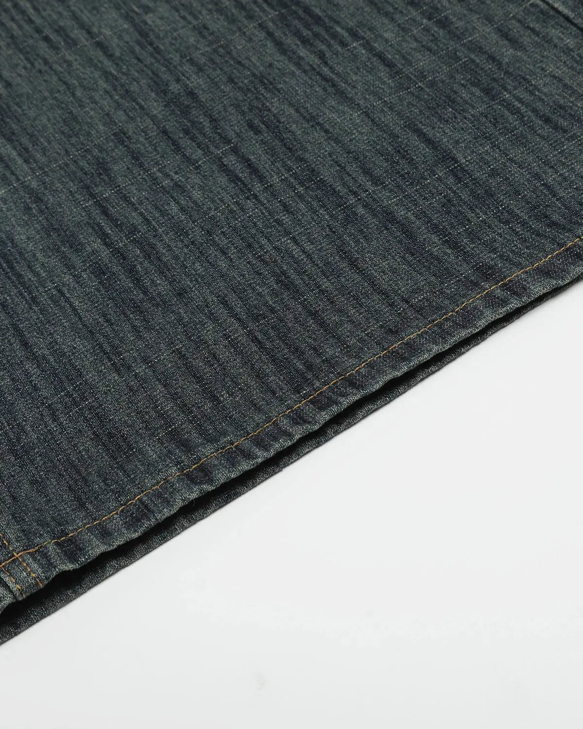 Raw wide-leg long jorts by INFLATION streetwear, featuring distressed denim and relaxed fit, displayed on a hanger.