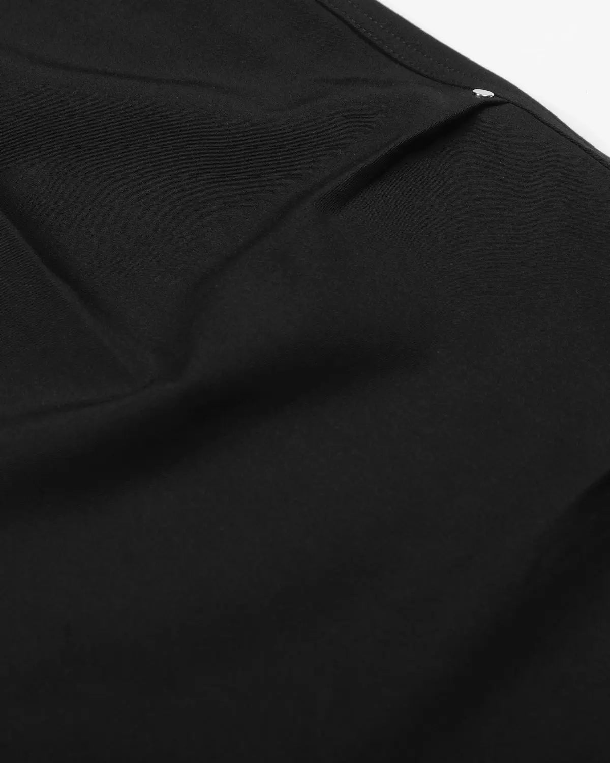 Inflation Streetwear pleated cinch back tailored shorts in beige fabric, showing the front view with waist detail and pleats.