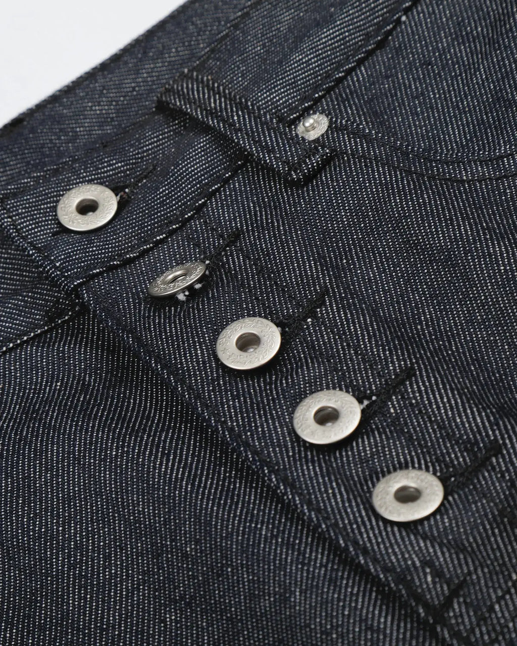 Inflation brand baggy denim jorts with button details, casual streetwear style, featuring distressed blue denim fabric.