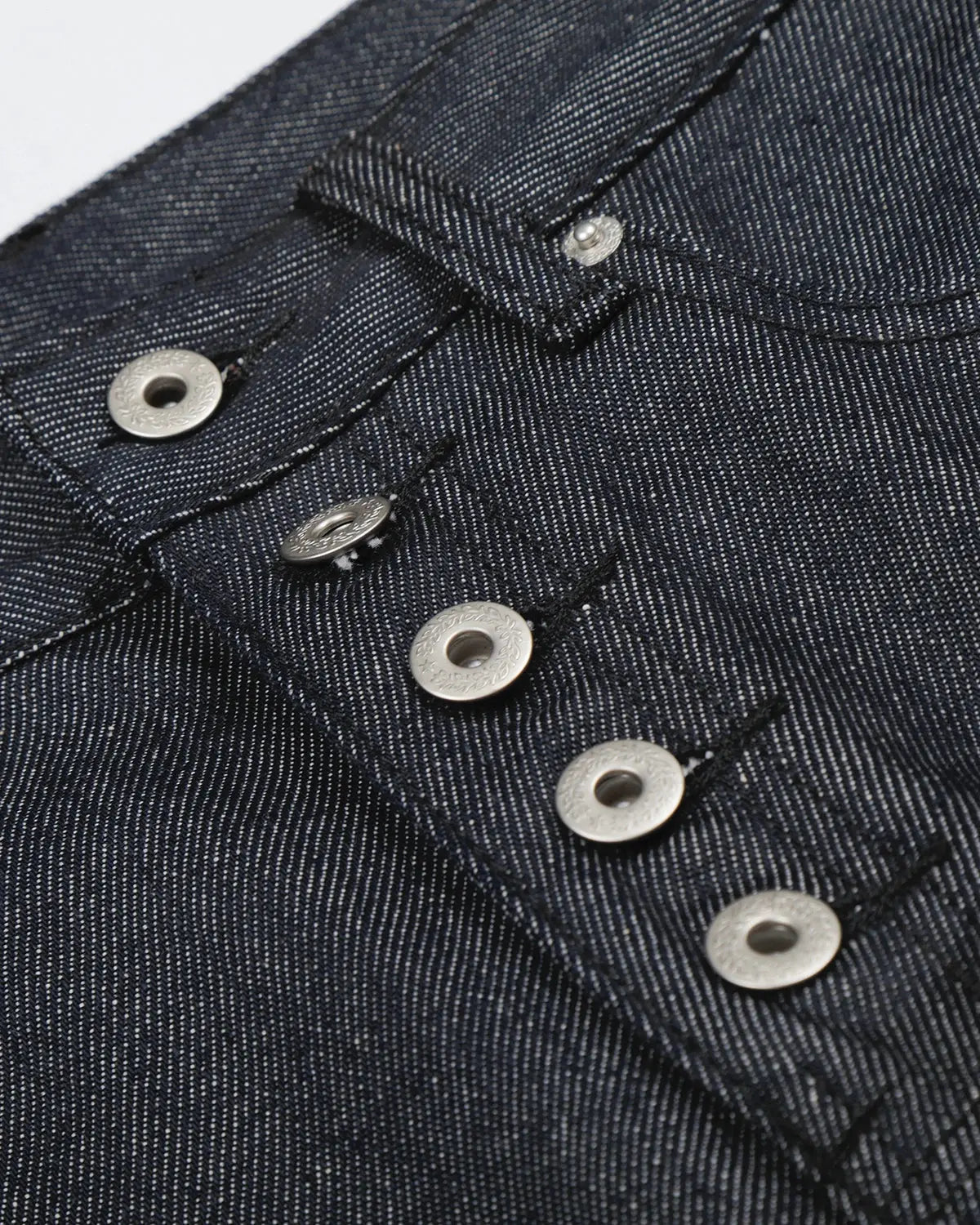 Inflation brand baggy denim jorts with button details, casual streetwear style, featuring distressed blue denim fabric.