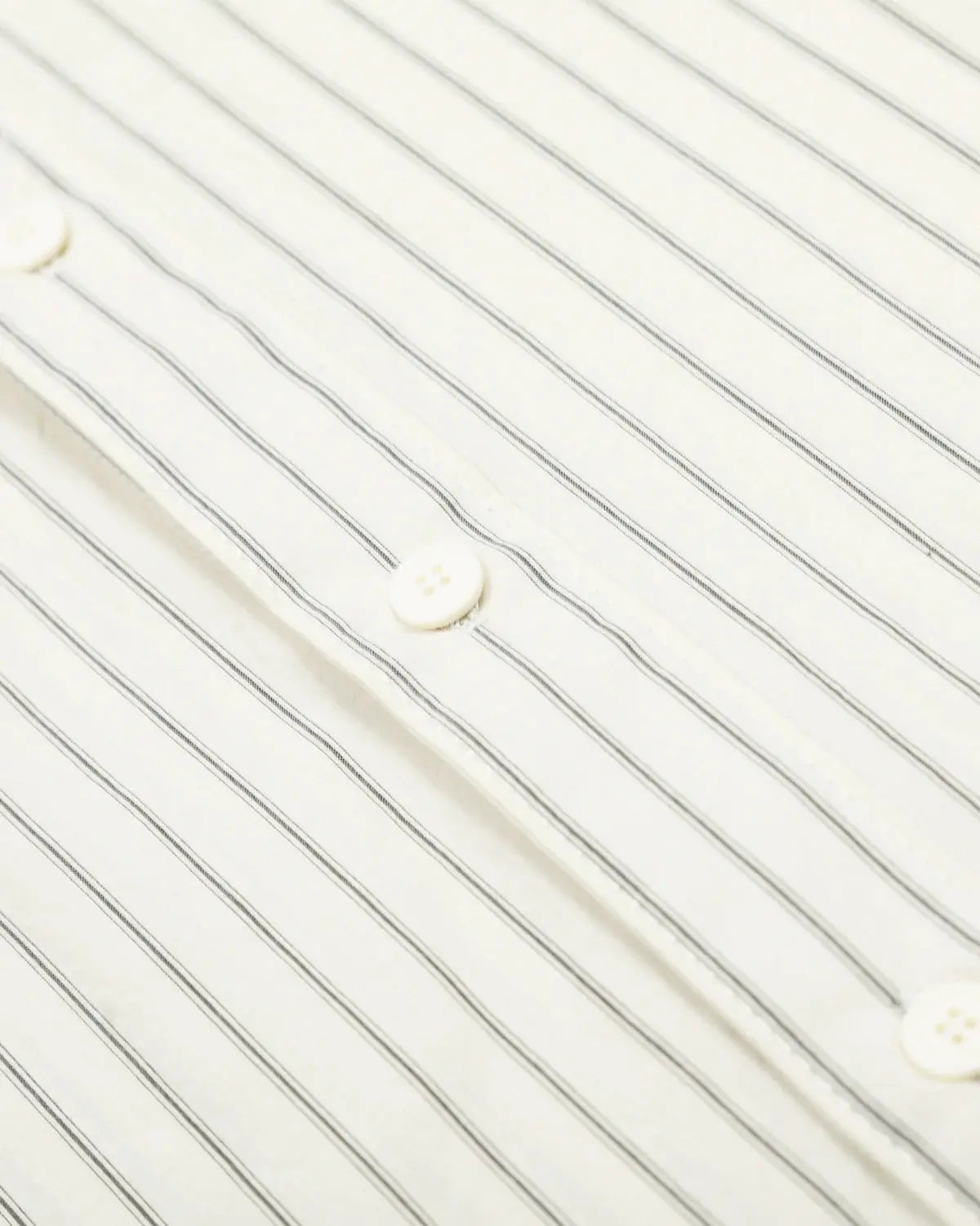 Striped embroidered short-sleeve shirt by INFLATION featuring colorful patterns and casual fit, displayed on a neutral background.