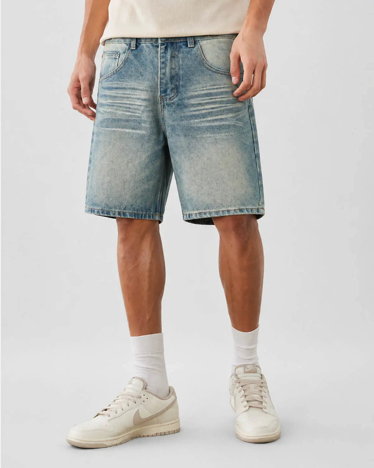 Mid-length washed denim shorts by Inflation Streetwear, showcasing distressed details, front pockets, and casual fit.