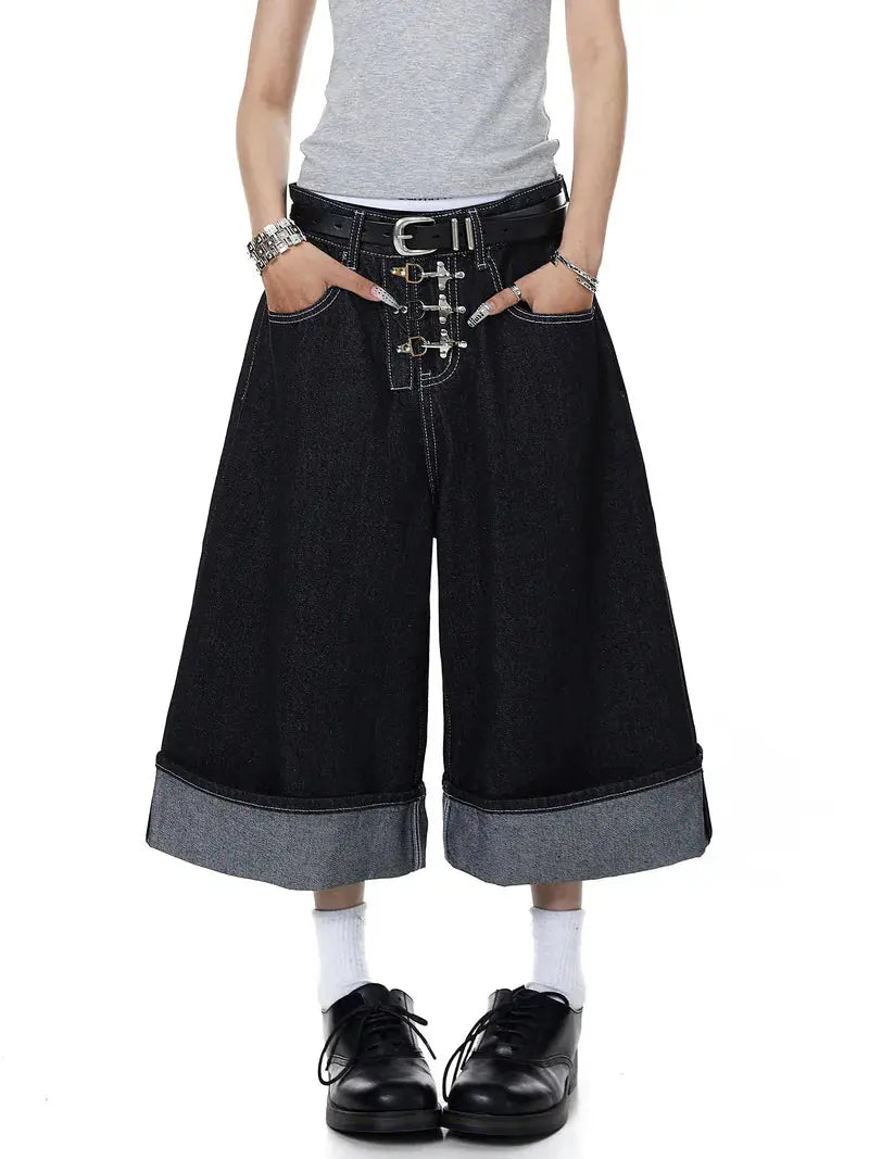 Inflation raw denim jorts with buckle detail, casual streetwear pants featuring distressed fabric and frayed hems.