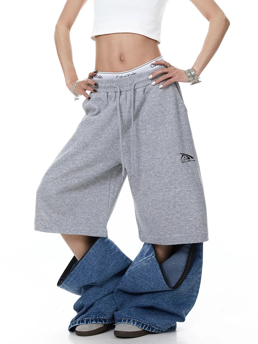 Denim detachable patchwork barrel joggers by INFLATION featuring stylish patchwork design and comfortable fit.
