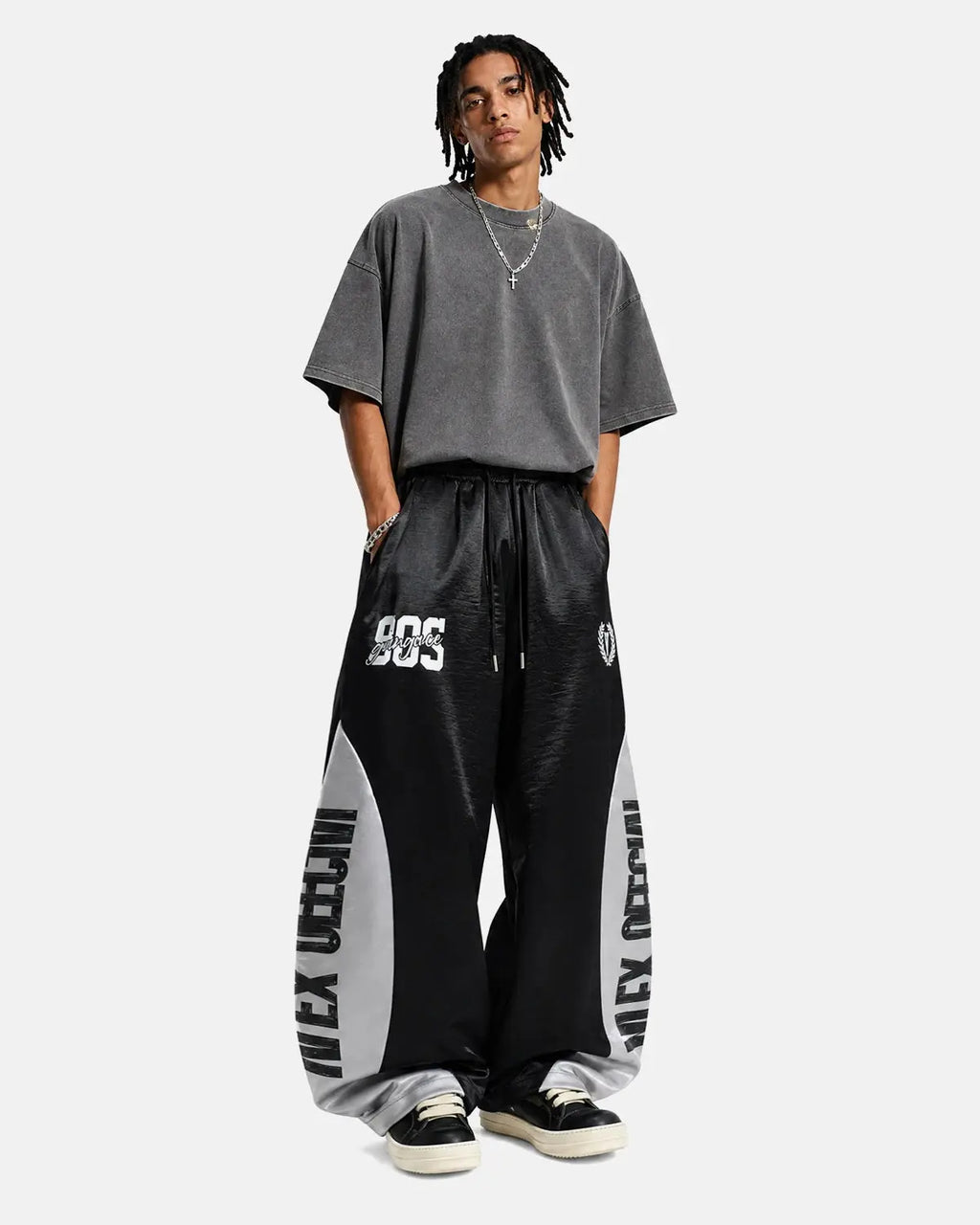 Glossy contrast barrel sweatpant by INFLATION featuring a relaxed fit and stylish color blocking, suitable for streetwear.