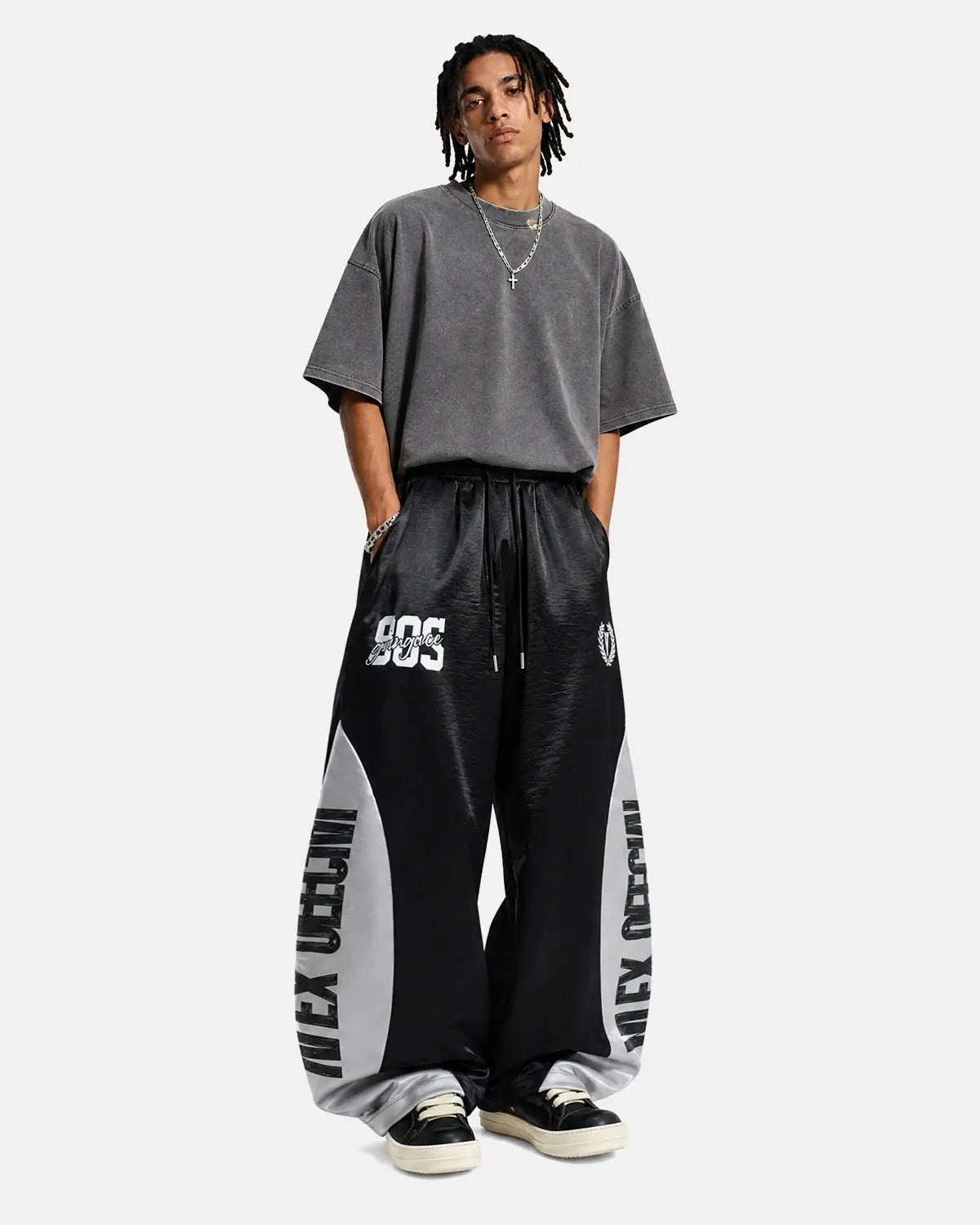 Glossy contrast barrel sweatpant by INFLATION featuring a relaxed fit and stylish color blocking, suitable for streetwear.