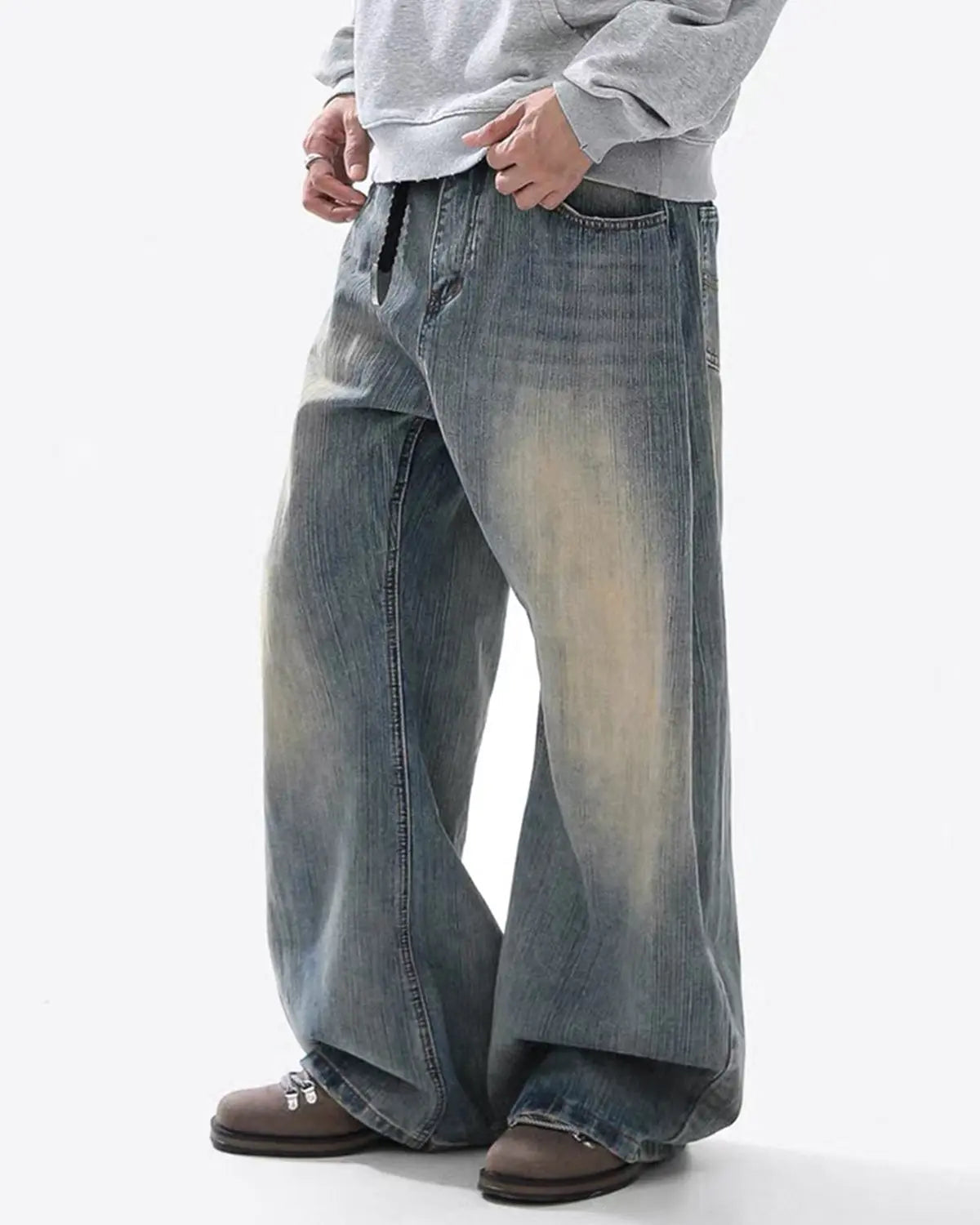Washed bamboo weave baggy bootcut jeans by INFLATION, showing relaxed fit, light wash denim, and casual streetwear style.