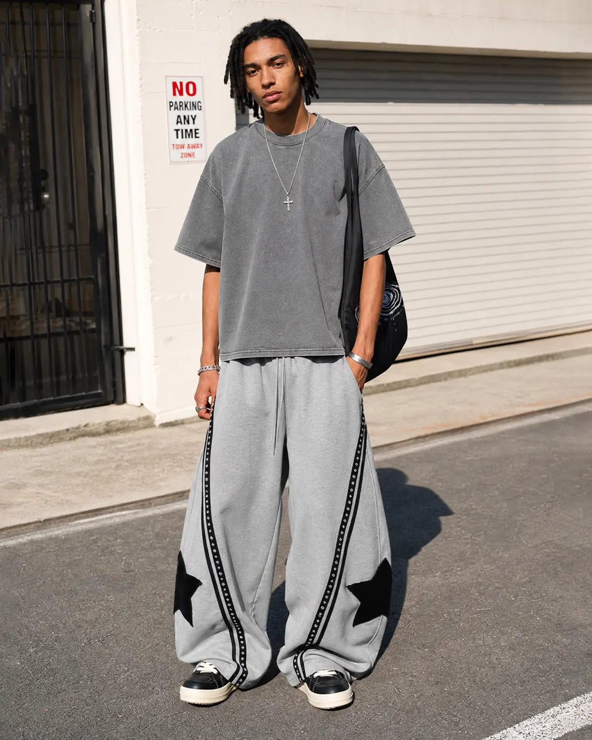 Contrast patchwork barrel sweatpants by INFLATION, featuring a relaxed fit and stylish design, displayed on a mannequin.