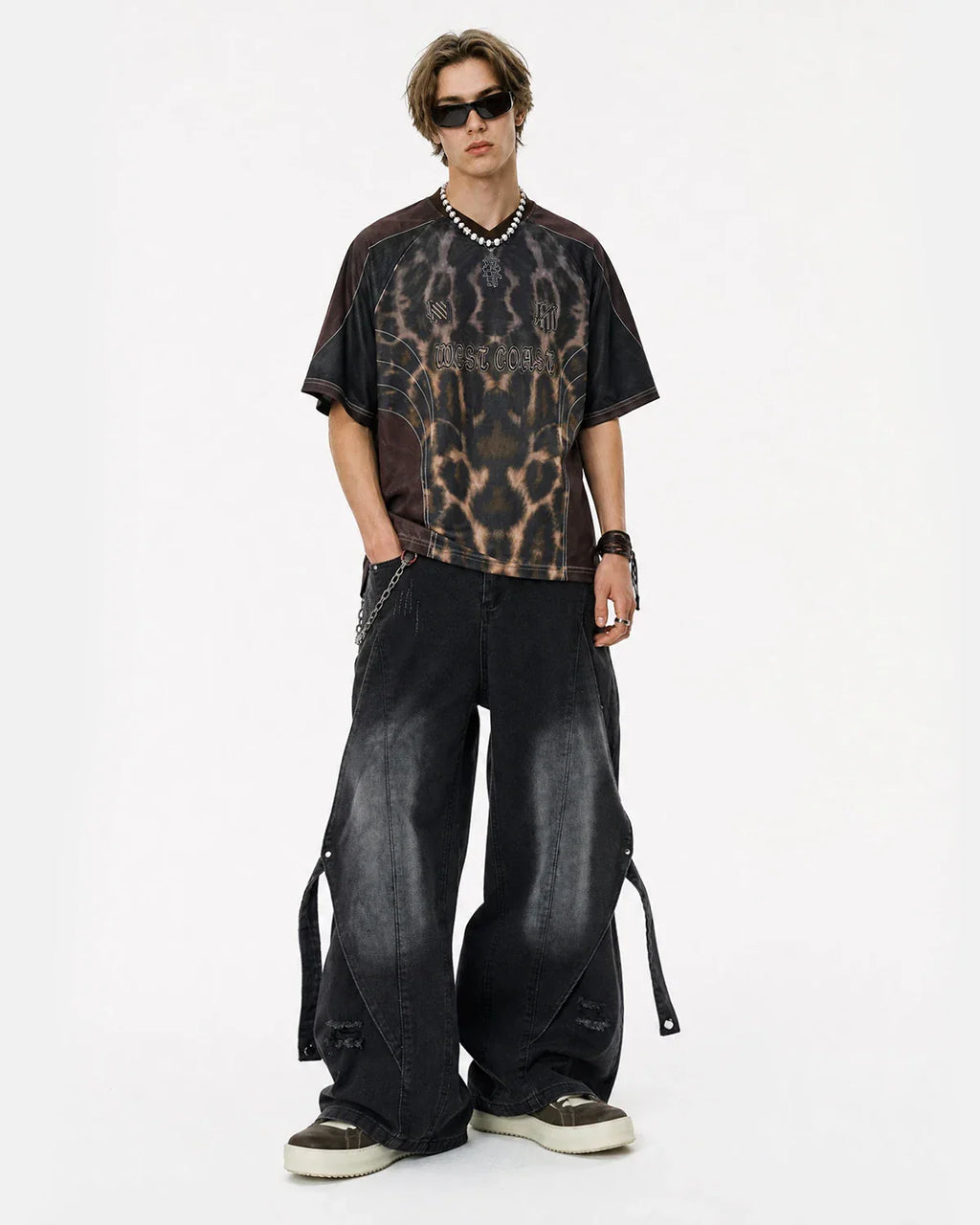 Inflation streetwear washed straight-leg jeans with adjustable straps, shown on a model with casual street style.