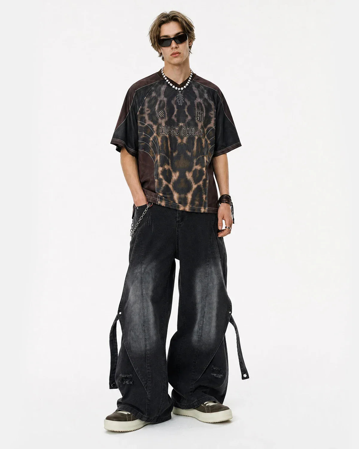 Inflation streetwear washed straight-leg jeans with adjustable straps, shown on a model with casual street style.