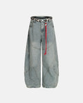 Acid wash stitching baggy jeans by INFLATION with distressed details and relaxed fit, showcasing the denim's texture and stitching.