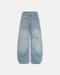 Inflation asymmetric button baggy jeans with oversized fit and unique button details, streetwear style, in denim fabric.