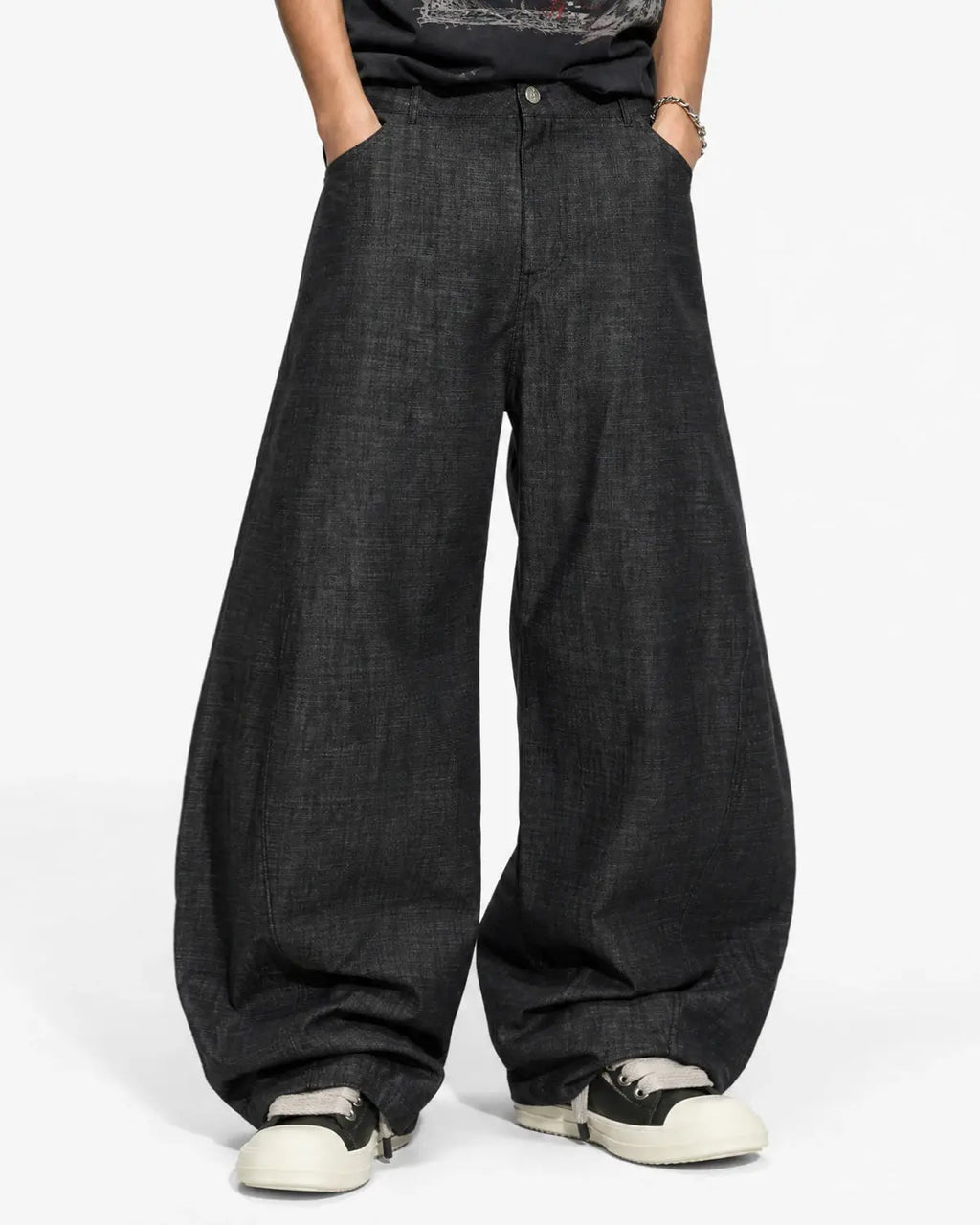 Lightweight raw barrel jeans by INFLATION featuring a relaxed fit, classic denim texture, and raw hem details.
