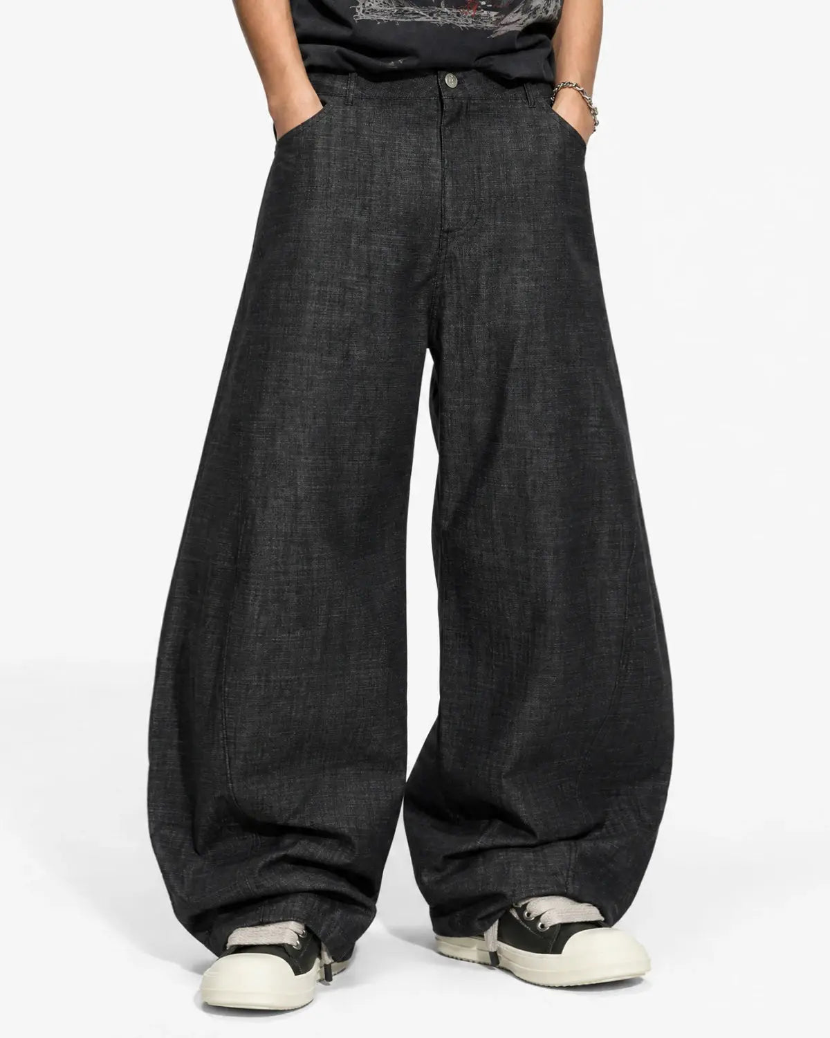 Lightweight raw barrel jeans by INFLATION featuring a relaxed fit, classic denim texture, and raw hem details.