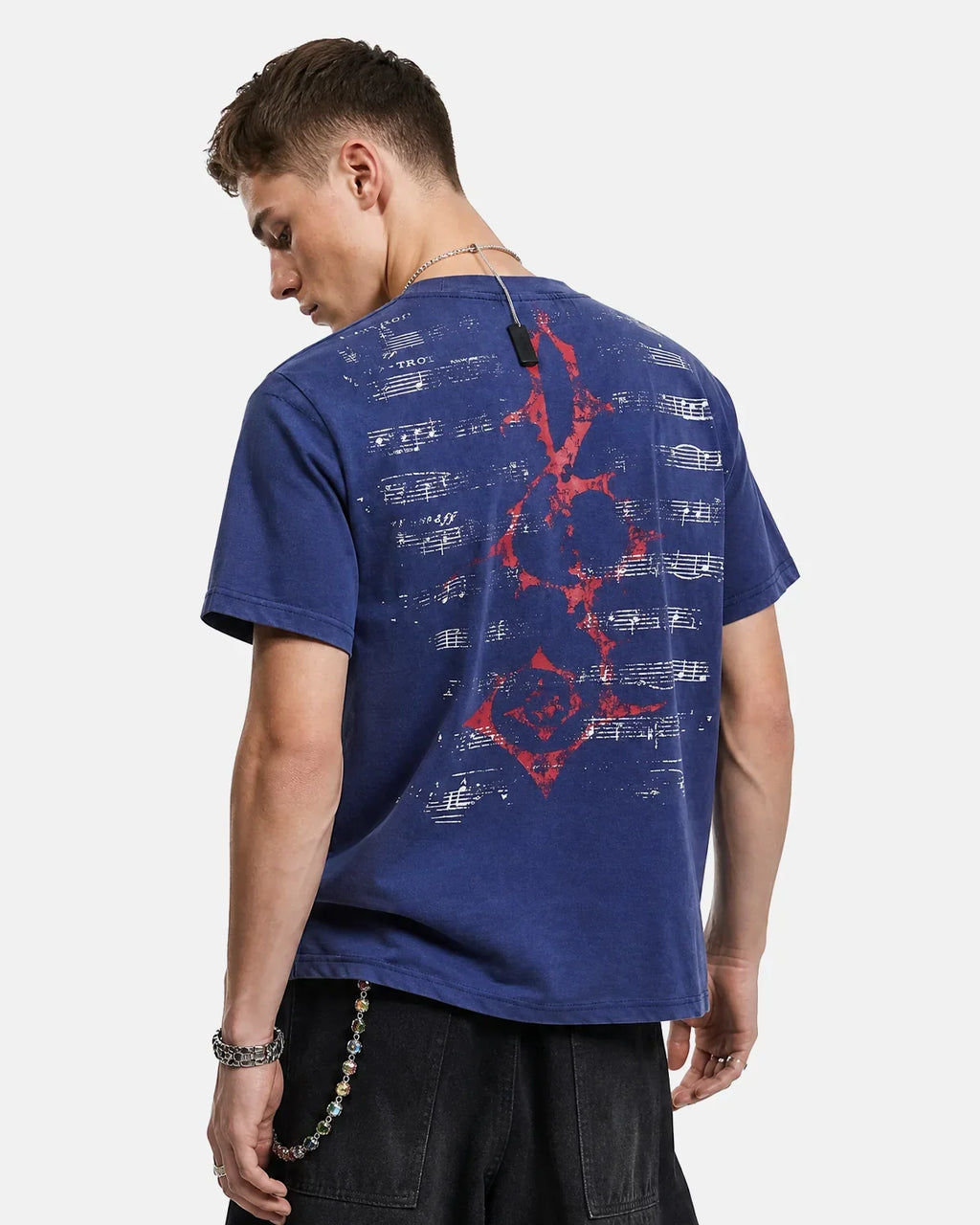 Acid Washed Music Graphic T-Shirt by INFLATION featuring a vibrant, artistic musical design on a casual streetwear tee.