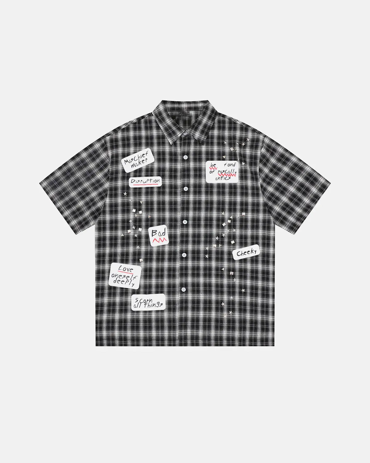 Inflation Streetwear plaid sticker graphic studded shirt showing a checkered pattern with patches and metal studs on the front.
