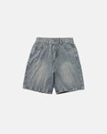 Textured washed longline jorts by INFLATION, denim-style pants with a relaxed fit and distressed finish, shown on a model.