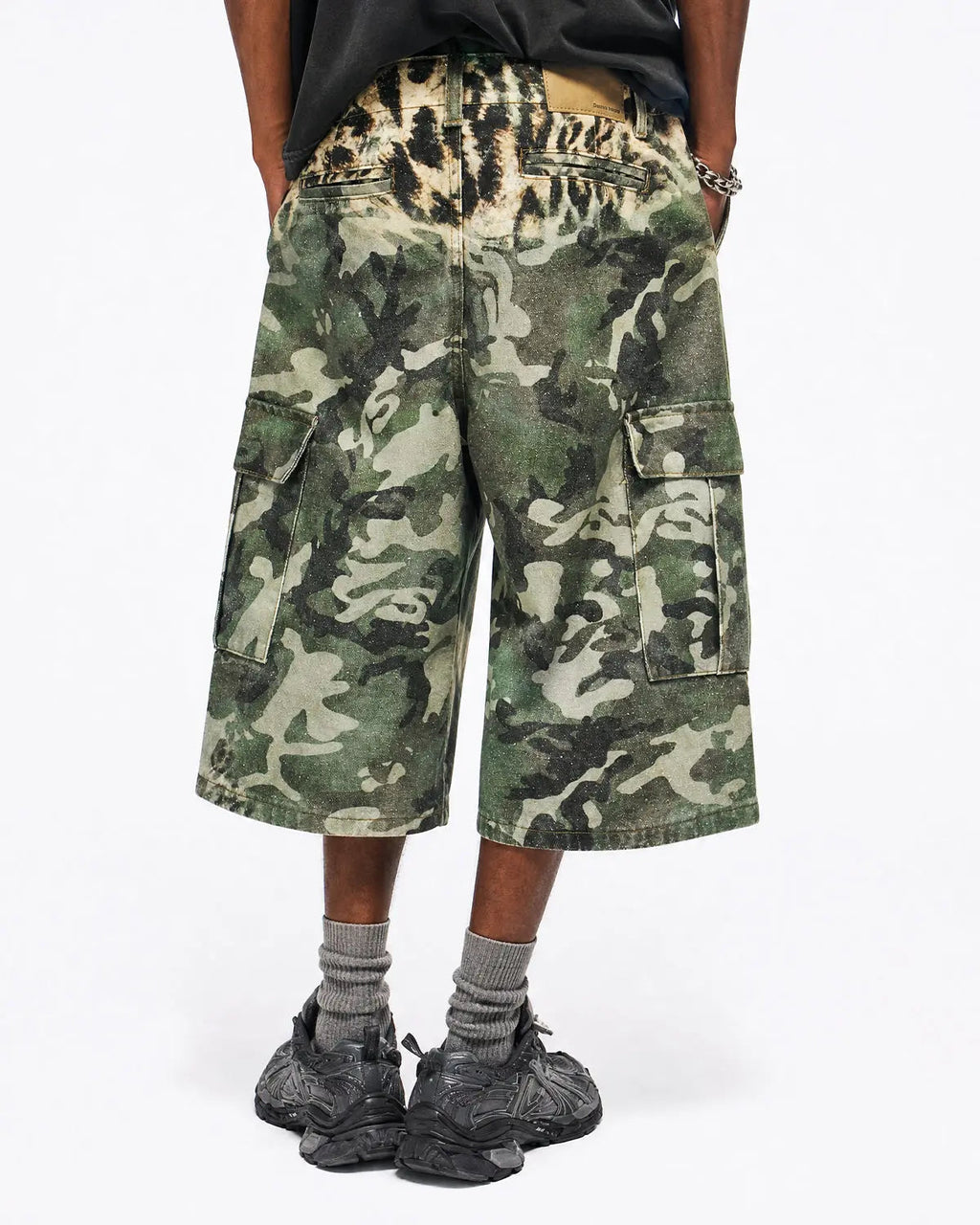 Leopard camo cargo longline shorts by INFLATION featuring a relaxed fit, multiple pockets, and bold streetwear style.