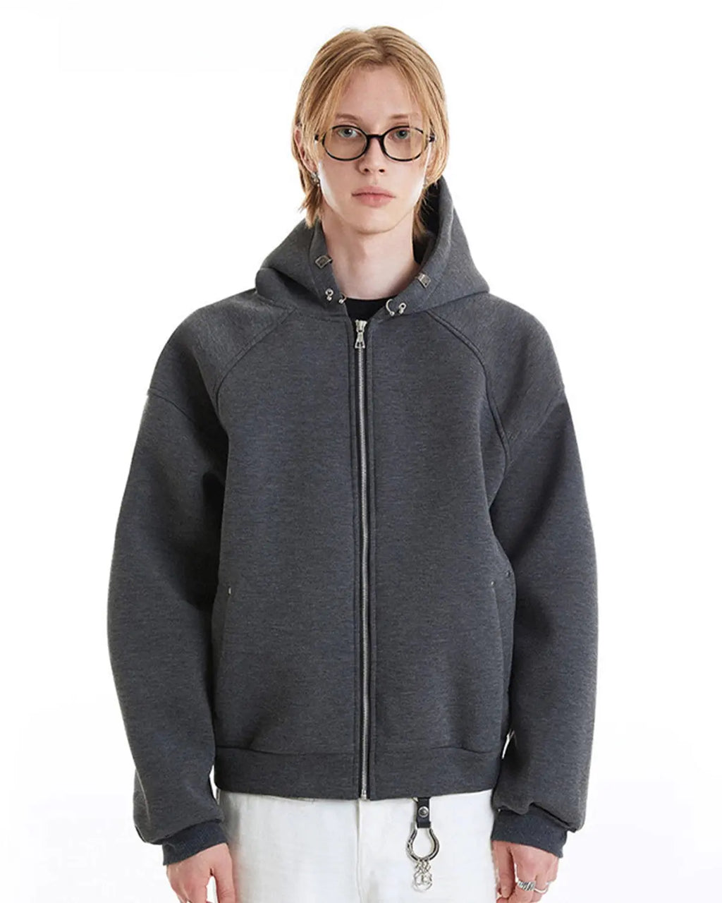 Inflation grey boxy zip-up hoodie with a front zipper, casual fit, and hood, shown on a model standing outdoors.