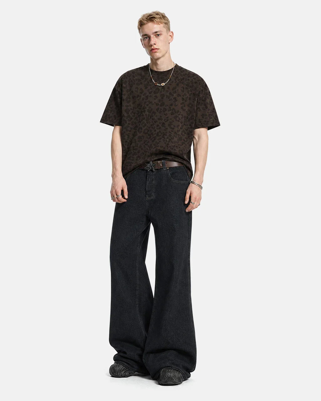 Inflation Super Raw Flared Baggy Jeans displayed on a model, showcasing their relaxed fit and stylish streetwear design.