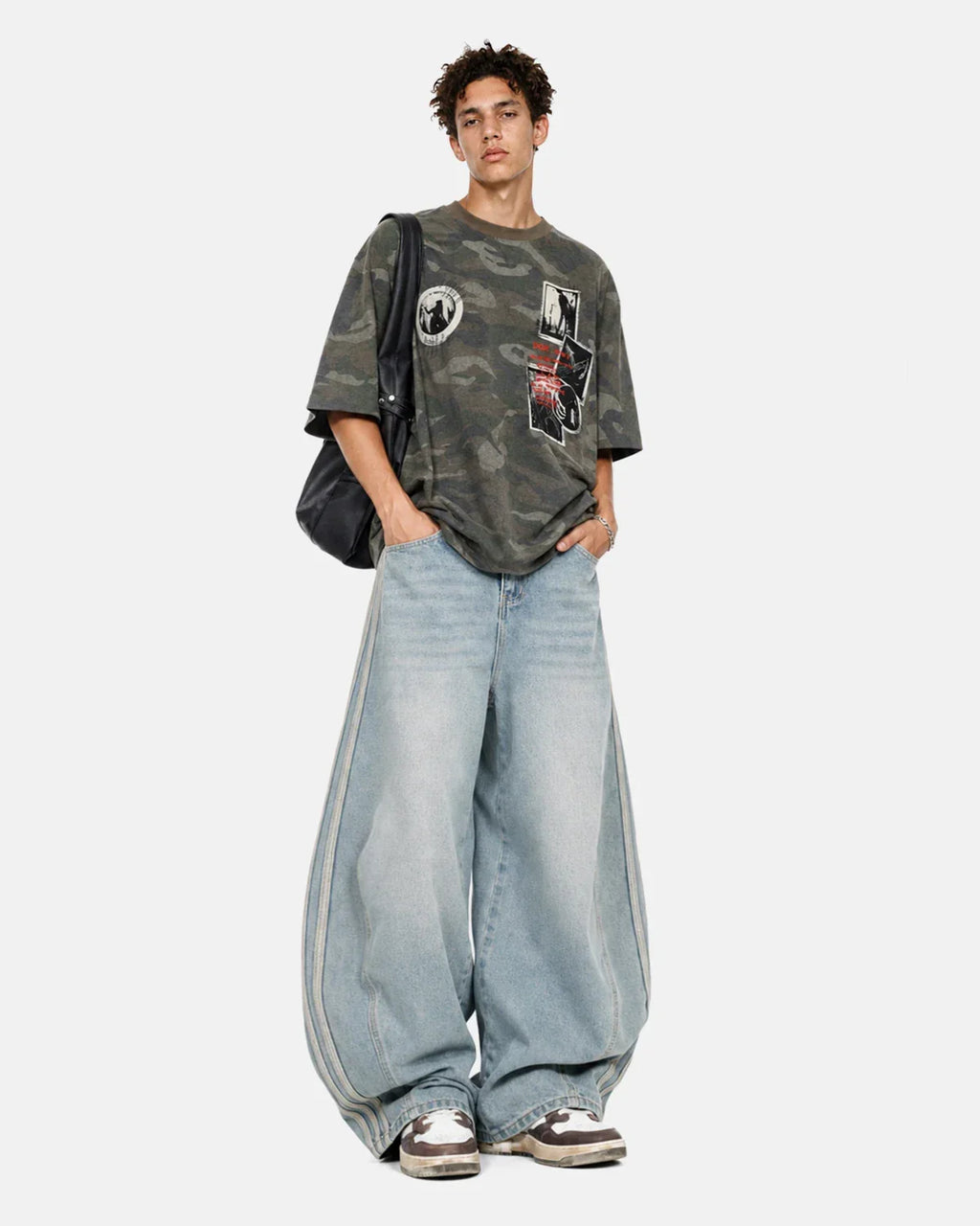 Acid wash striped side baggy jeans by INFLATION featuring relaxed fit, distressed details, and bold striped design.