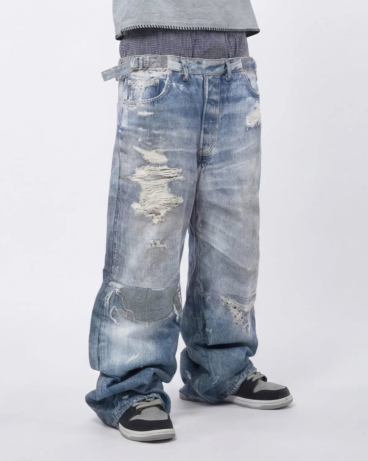 Layered digital print baggy jeans by Inflation Streetwear featuring a relaxed fit and bold graphic design.