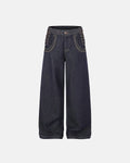 Inflation Side Lace-Up Raw Baggy Jeans showing distressed denim, loose fit, and lace-up details on a streetwear model.
