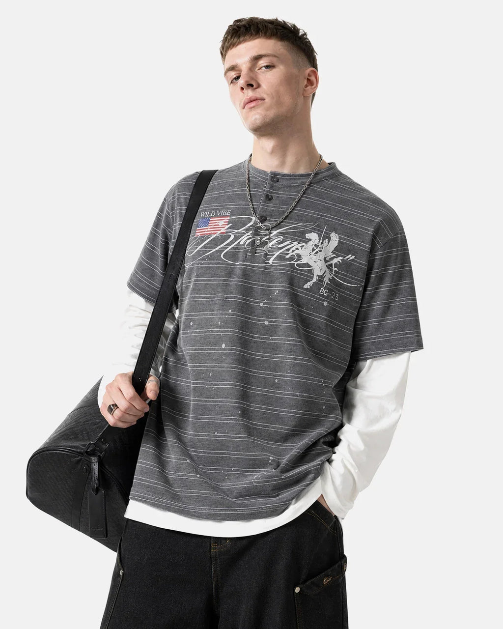 Layered Henley Stripe T-Shirt by INFLATION, featuring a casual striped design and layered neckline, worn by a model.