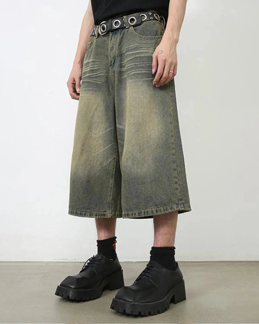 Baggy jumbo jorts by INFLATION, casual denim shorts with a loose fit, visible stitching, and distressed details.