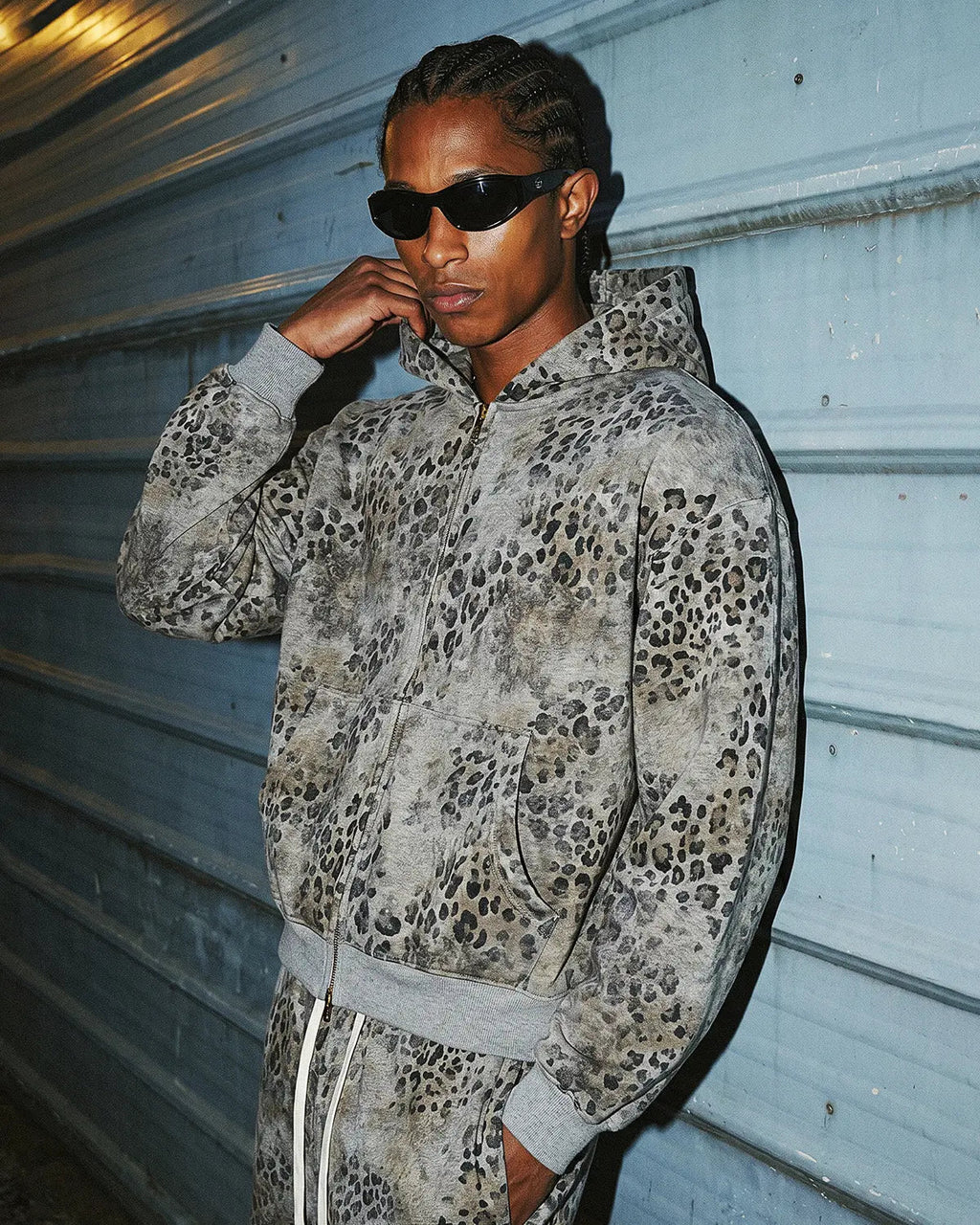 Leopard print boxy zip-up hoodie by INFLATION featuring a stylish zipper closure and bold animal pattern design.