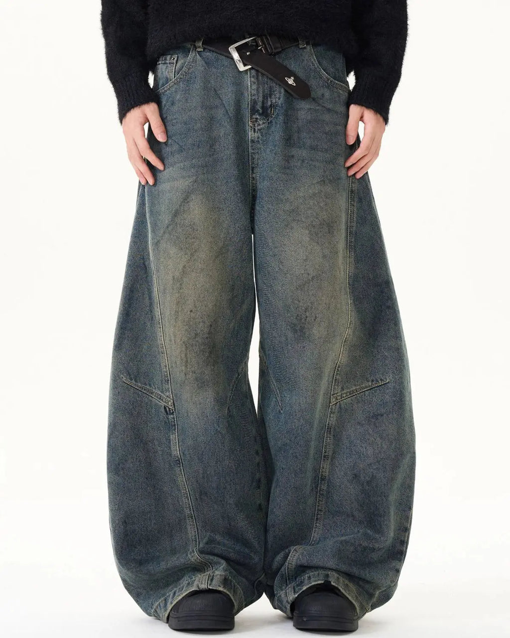 Washed deconstructed barrel jeans by Inflation Streetwear featuring distressed details and relaxed fit denim.