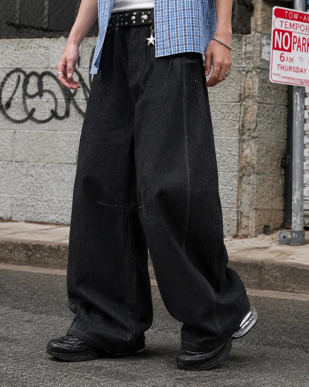 INFLATION Raw Color Barrel Baggy Jeans, casual pants with a relaxed fit and raw hems, displayed on a neutral background.