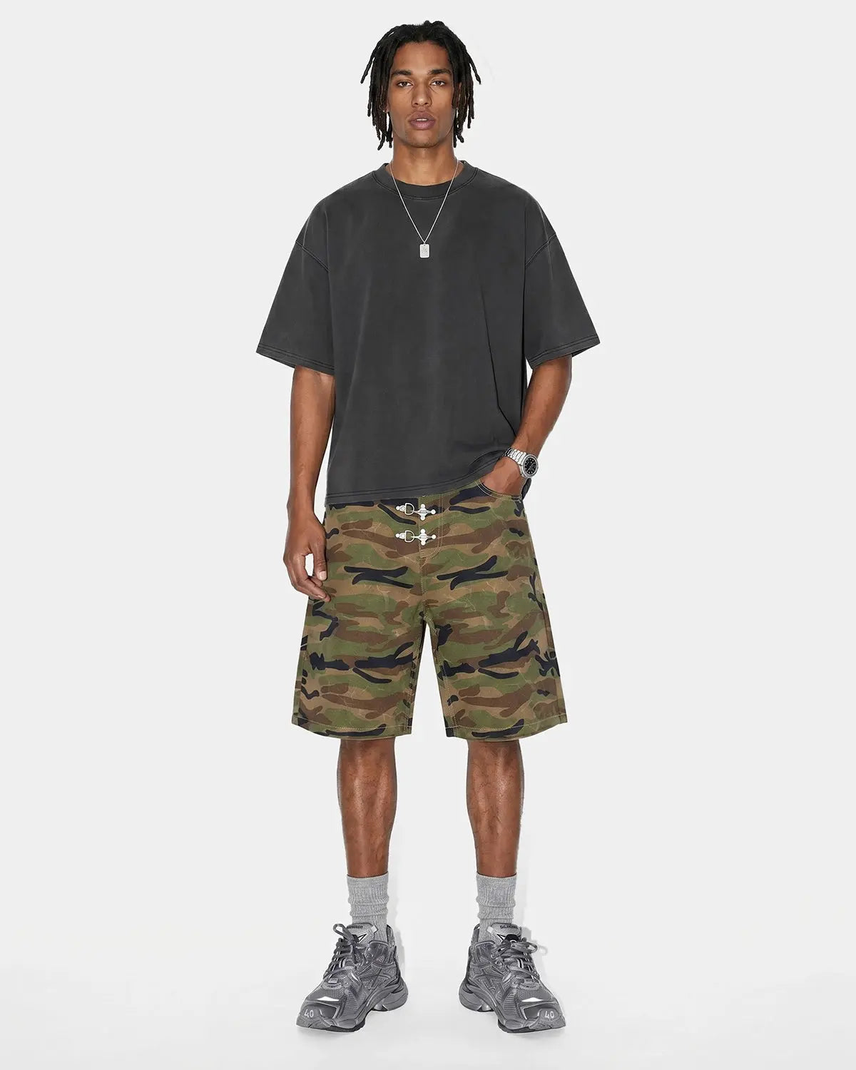 Inflation Metal Clasp Camo Shorts, stylish streetwear pants with camouflage pattern and metal clasp detail.