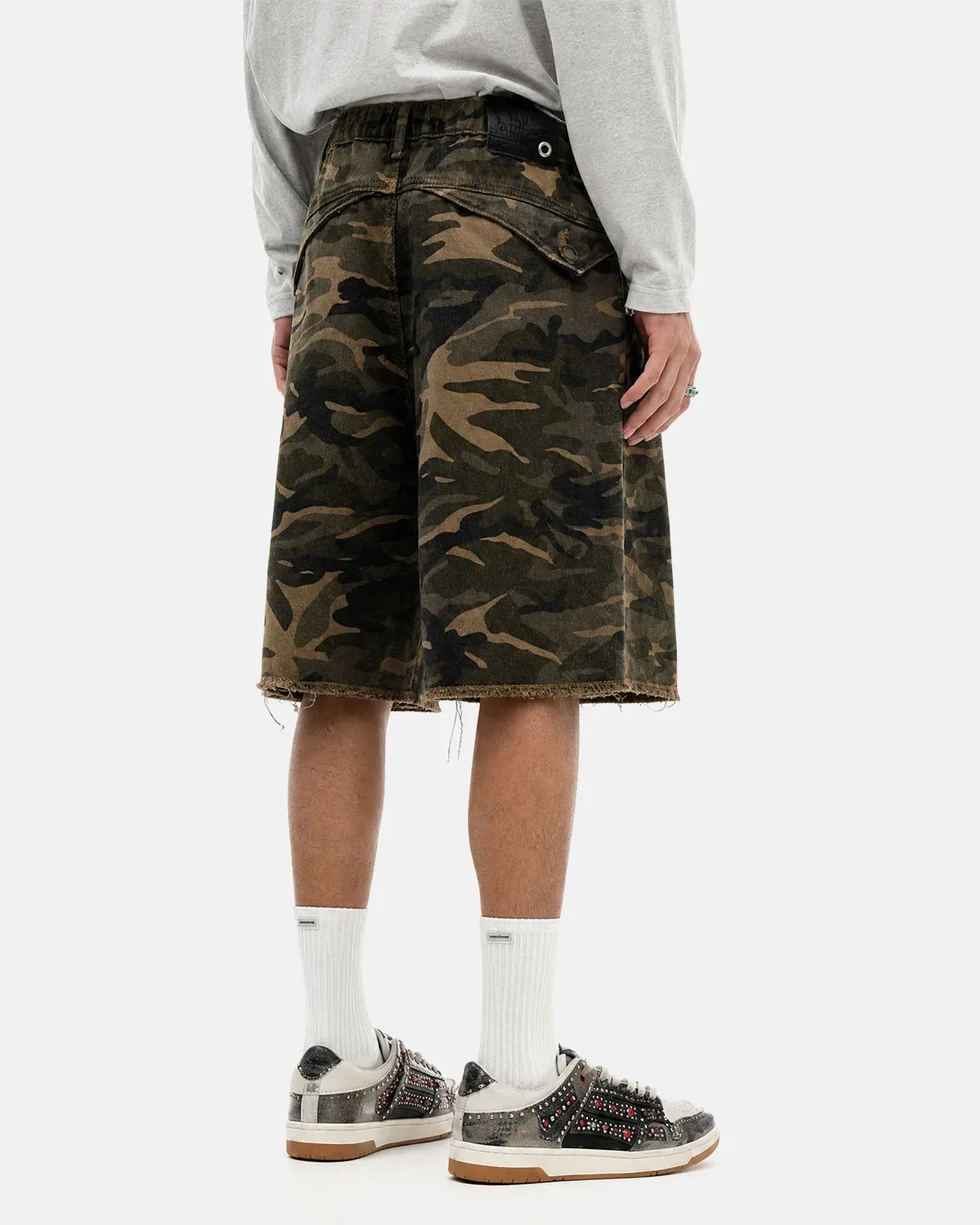 Frayed hem camo knee-length shorts by INFLATION Streetwear, featuring a stylish camouflage pattern and distressed hem detail.
